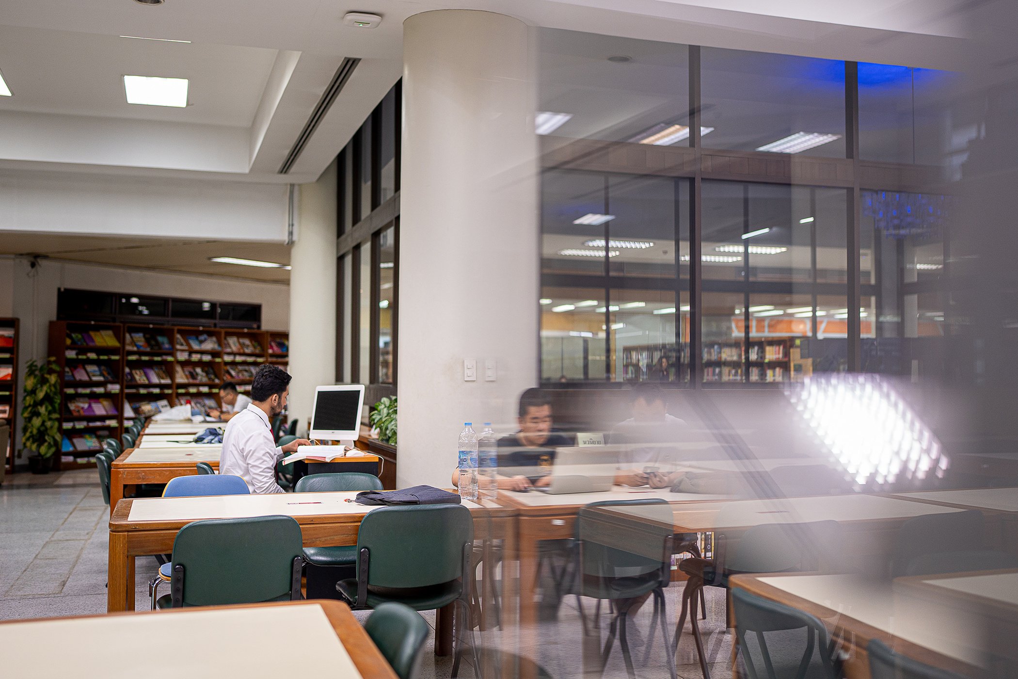 A refugee in Thailand studying at Siam University's library 