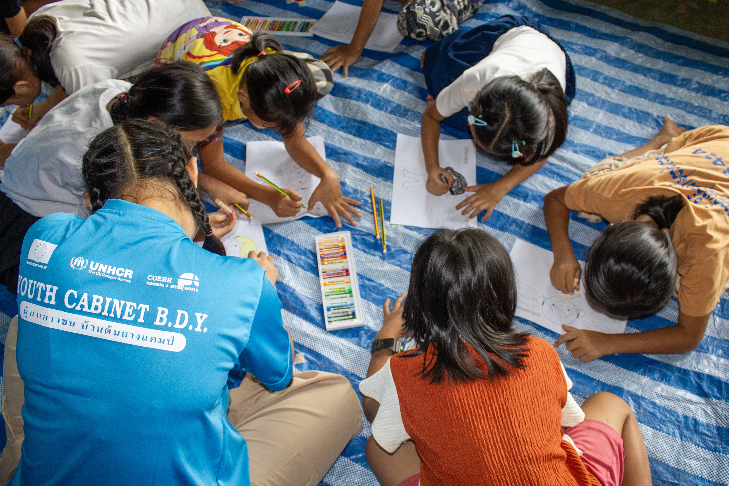 Refugee youth volunteers conducting a self-awareness and self-protection session for school children in Ban Don Yang refugee camp, Thailand.