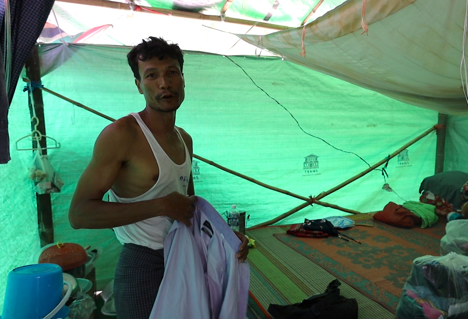 Ko Thein Naing rebuilding his home brick by brick after the earthquake, determined to return home with his family