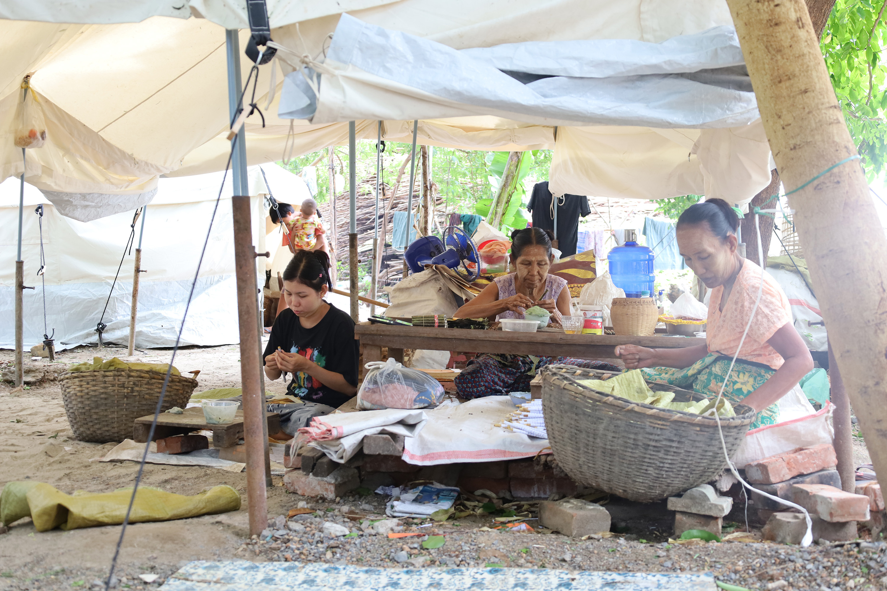Women roll cigars for daily wages, working to support their families and rebuild stability now that they have a safe shelter. 