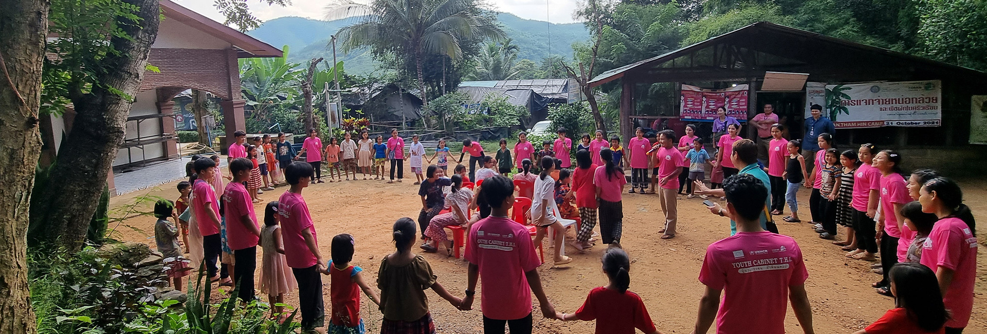 Youth volunteers conducting a session on self-protection for children in Tham Hin refugee camp, Thailand. 