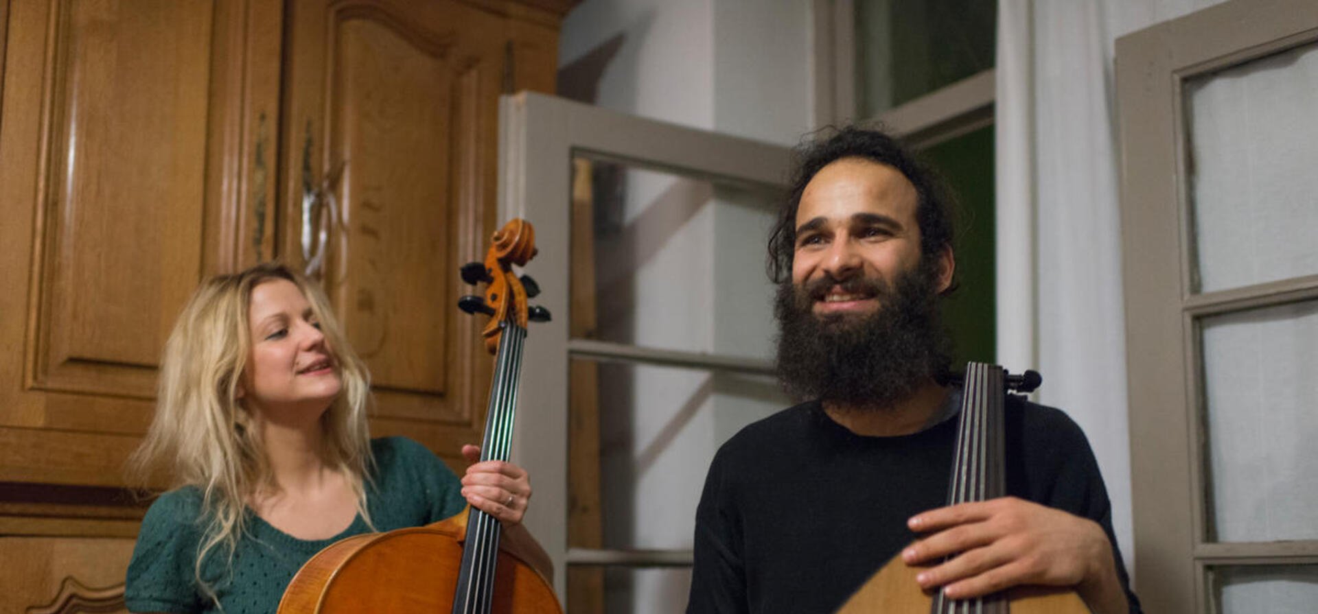 Belgium. An iraki refugee playing lute.