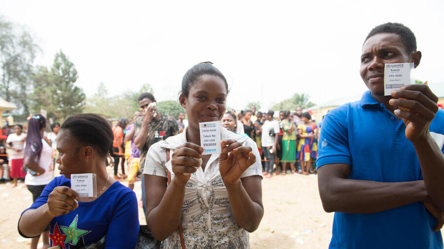 Nigeria. Cameroonian refugees wait to be verifed with their food tokens for relief materials and food distribution in Ikom