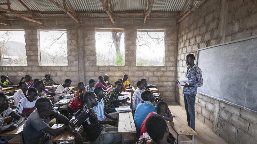 South Sudanese teacher Lim Bol teaches at a primary school in Kule refugee camp, Ethiopia, March 2016.