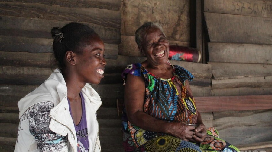 Two refugee women laughing