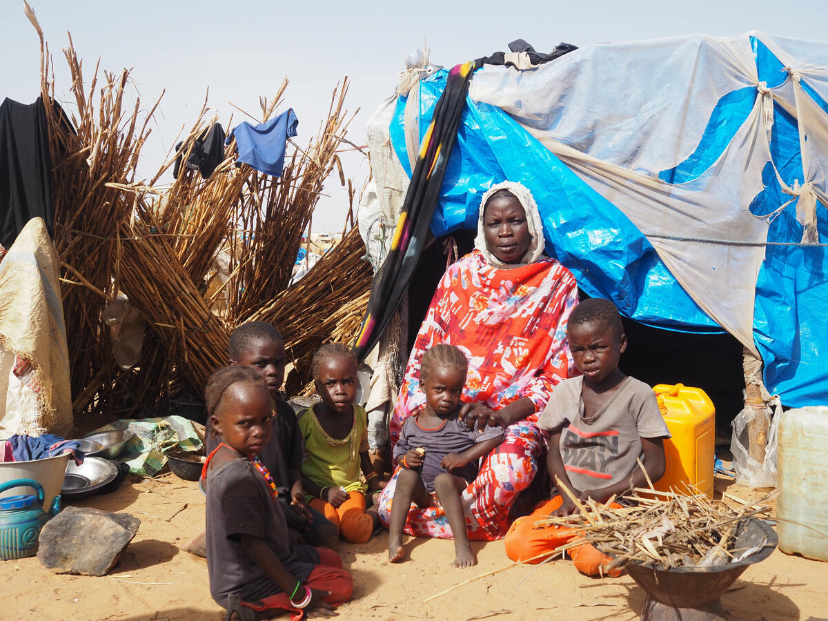Sudanese refugees live in makeshift shelter at the border in Adre, Chad