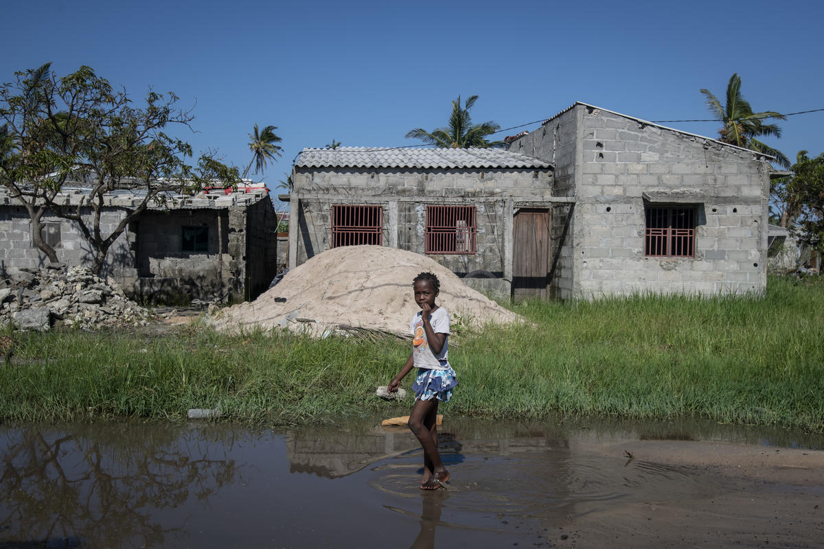 Mozambique. A girl walks through flood waters