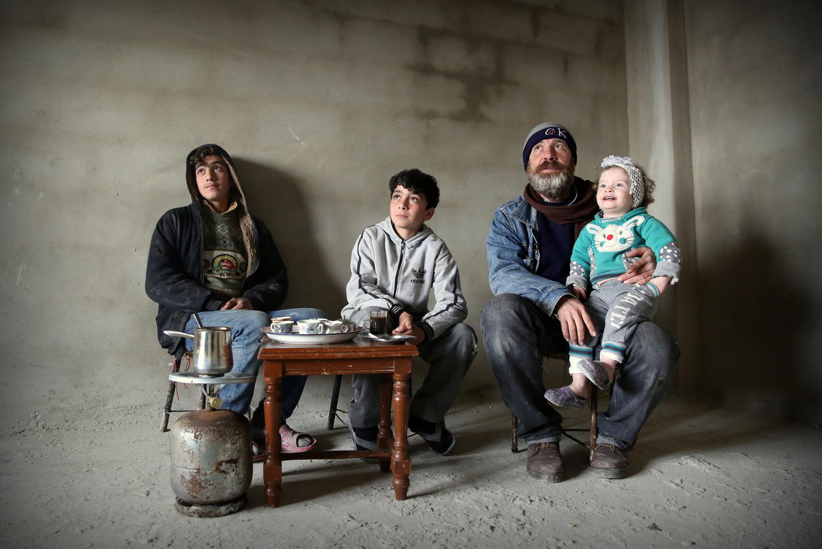 Syrian. Returnee family embrace their homing instinct