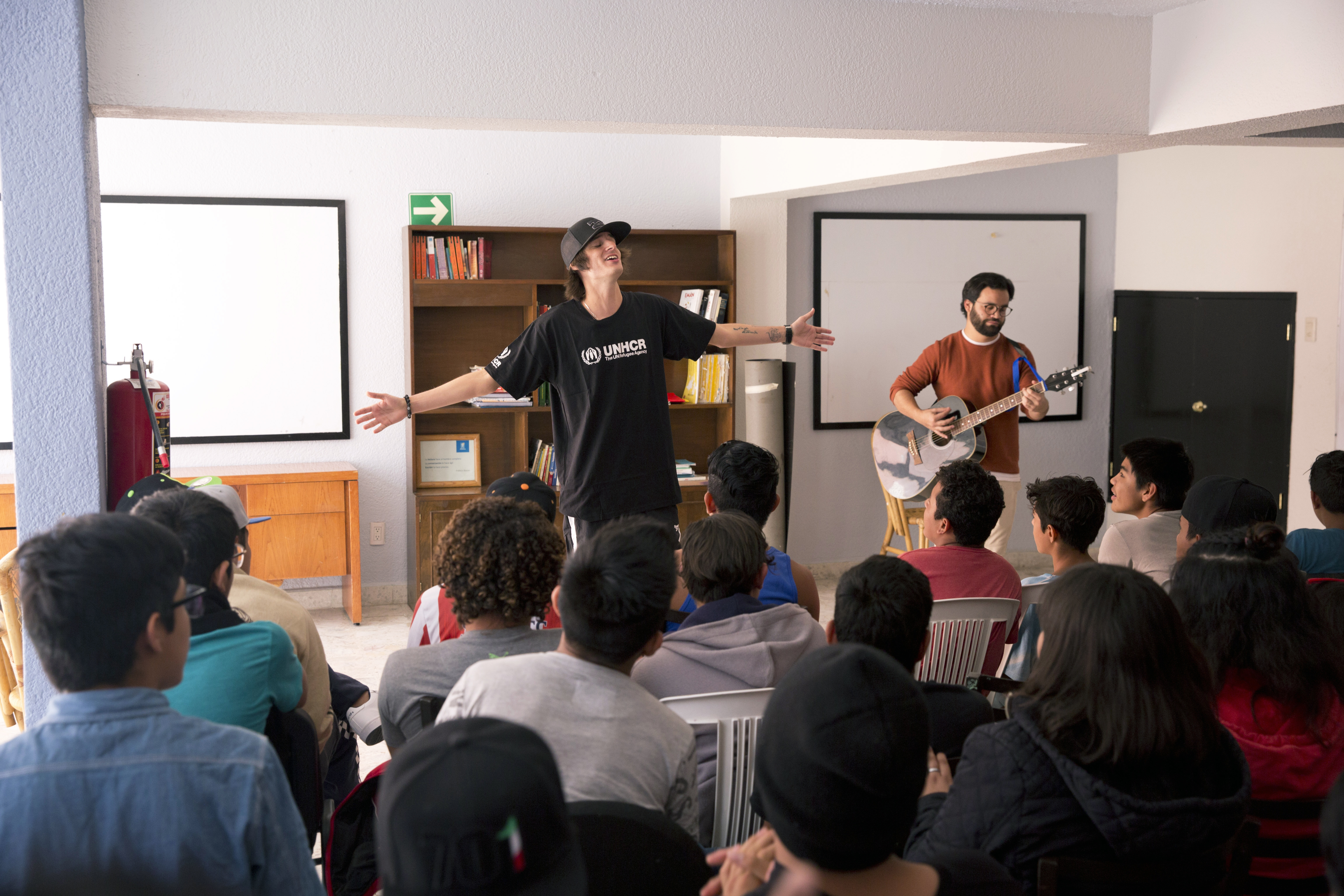 Danny Ocean performing for the kids at the shelter.