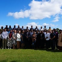 Event attendees gather for a group photo