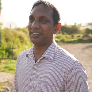 Sebastian smiles into the distance