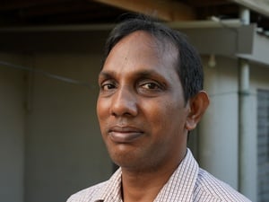 Sebastian smiles into the camera