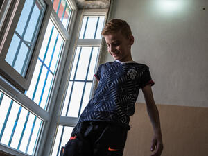 Iraq. Yazidi child gets ready to reunite with his mother in Canada