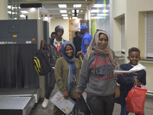 Refugees arrive in Kigalii, Rwanda after an evacuation flight form Libya