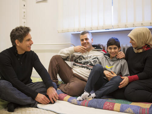 Germany. Actor Ben Stiller meets Nahed and her family at an emergency shelter in Berlin
