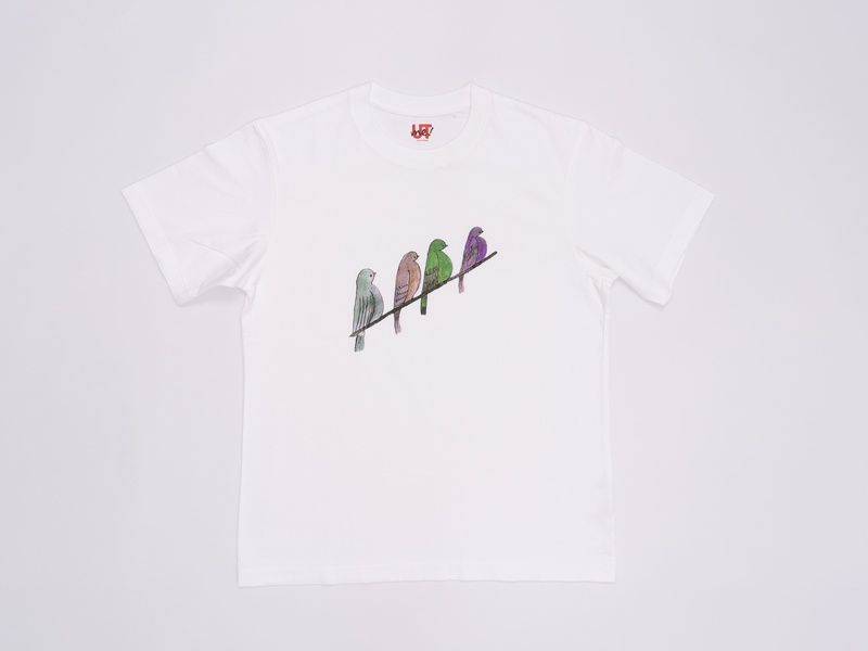 A white t-shirt with an illustration of four birds standing next to each other on a thread.
