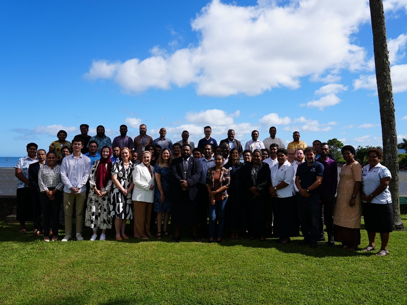 Event attendees gather for a group photo