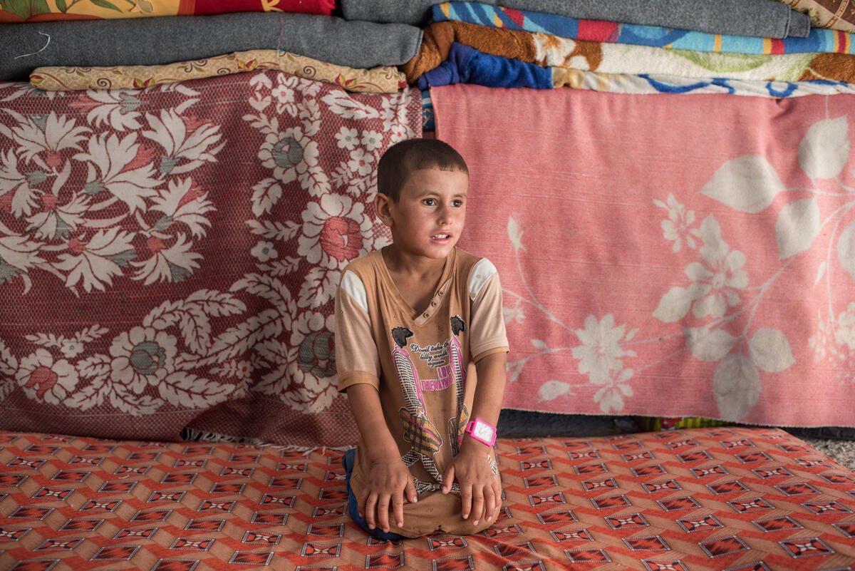 Iraq. People adjusting to life after losing their husbands and fathers.