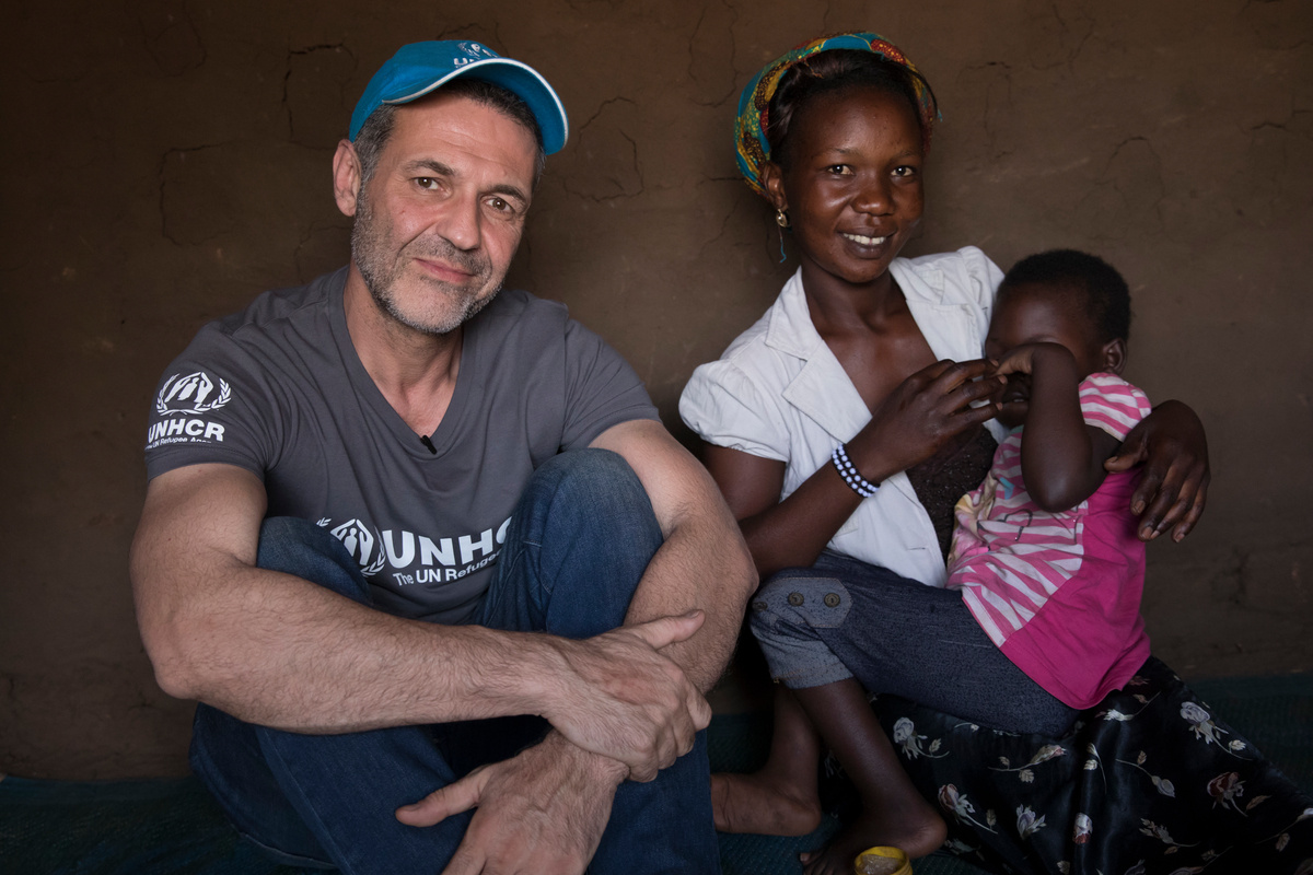 Uganda. UNHCR Goodwill Ambassdor Khaled Hosseini meets South Sudanese refugee, Aisha, in Bidibidi refugee settlement