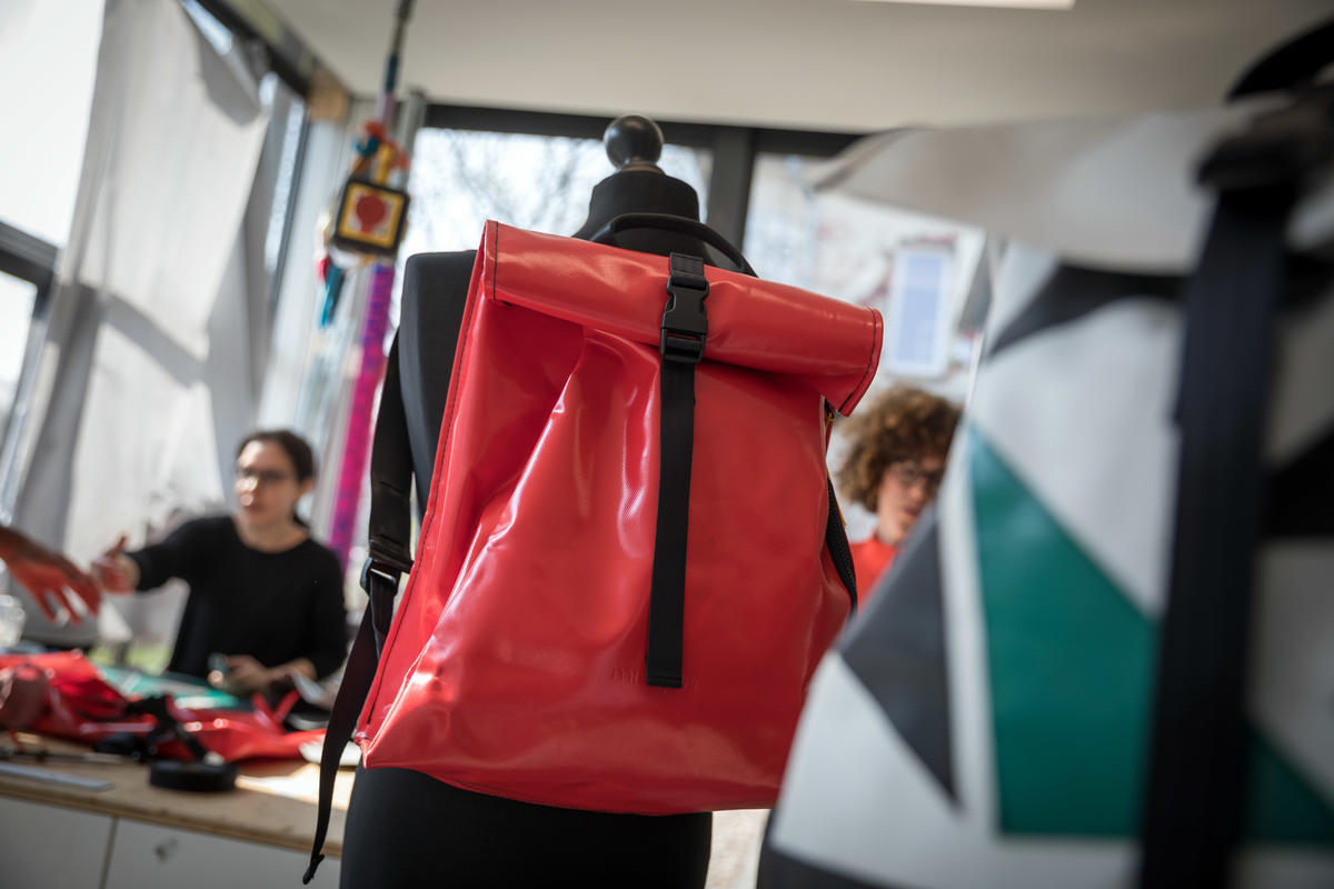 Germany. A non-profit initiative is employing newcomers to upcycle broken refugee boats into thought-provoking products.