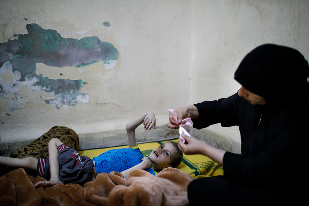 Jordan. A group of refugee women make sweets for Eid and distribute to needy families