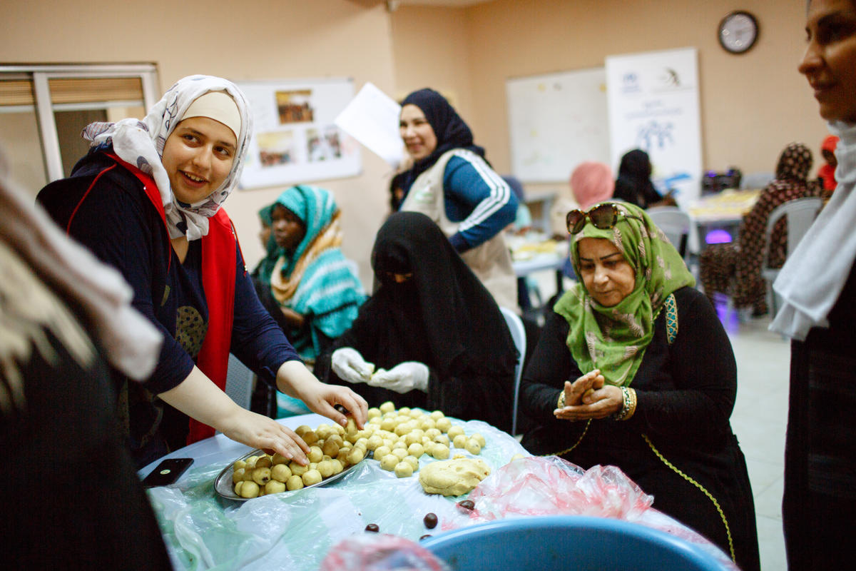 Jordan. A group of refugee women make sweets for Eid and distribute to needy families