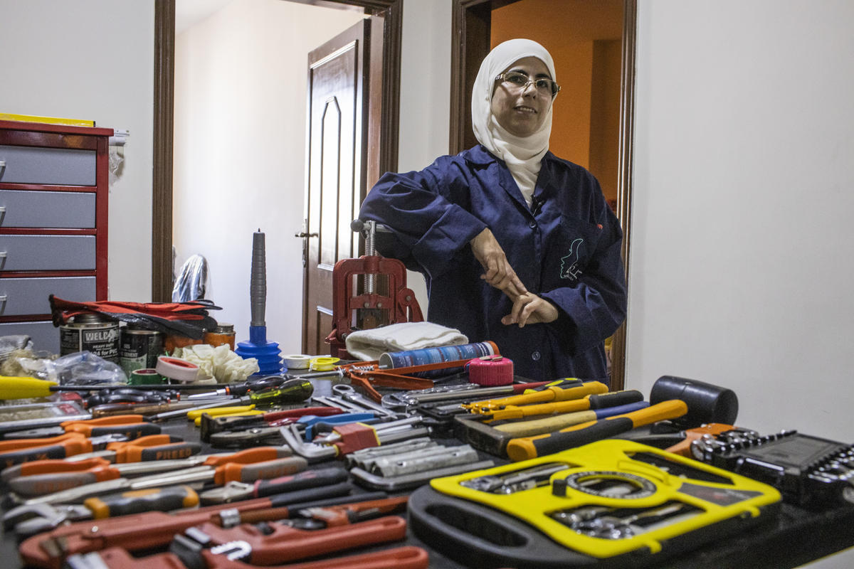 Jordan. Female plumber teaches refugees her trade