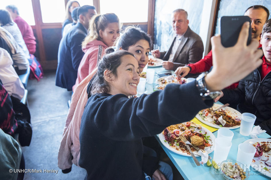 The popular restaurant at the lakefront Bains des Pâquis provides lunch for a group of refugees – attended by UN High Commissioner for Refugees Filippo Grandi – during the Global Refugee Forum in Geneva.