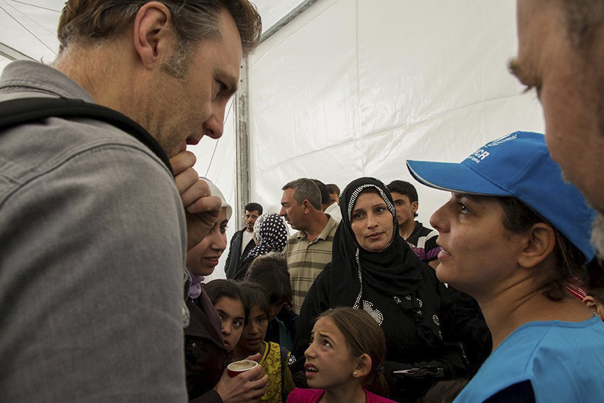 David Morrissey UNHCR High profile supporter meets and talks with Syrian refugees queuing up at the UNHCR registration offices in Amman, Jordan