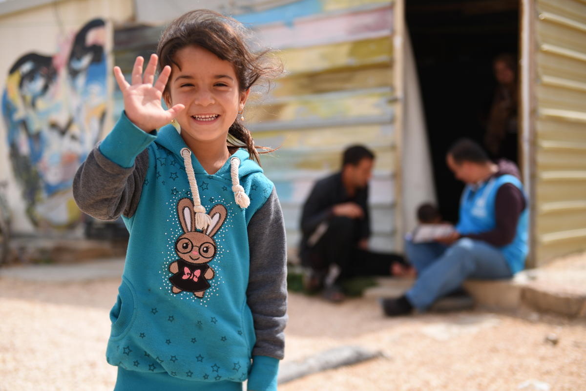 Jordan. Syrian families gather outside of a Za'atari employment centre seeking information on work opportunities