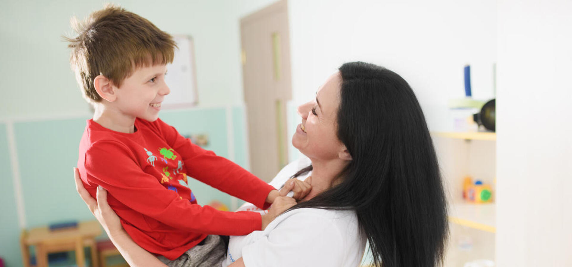 Olena Abayeva plays with her son Vlad in the centre for children with mental disorders opened by Olena in Sumy with support from UNHCR