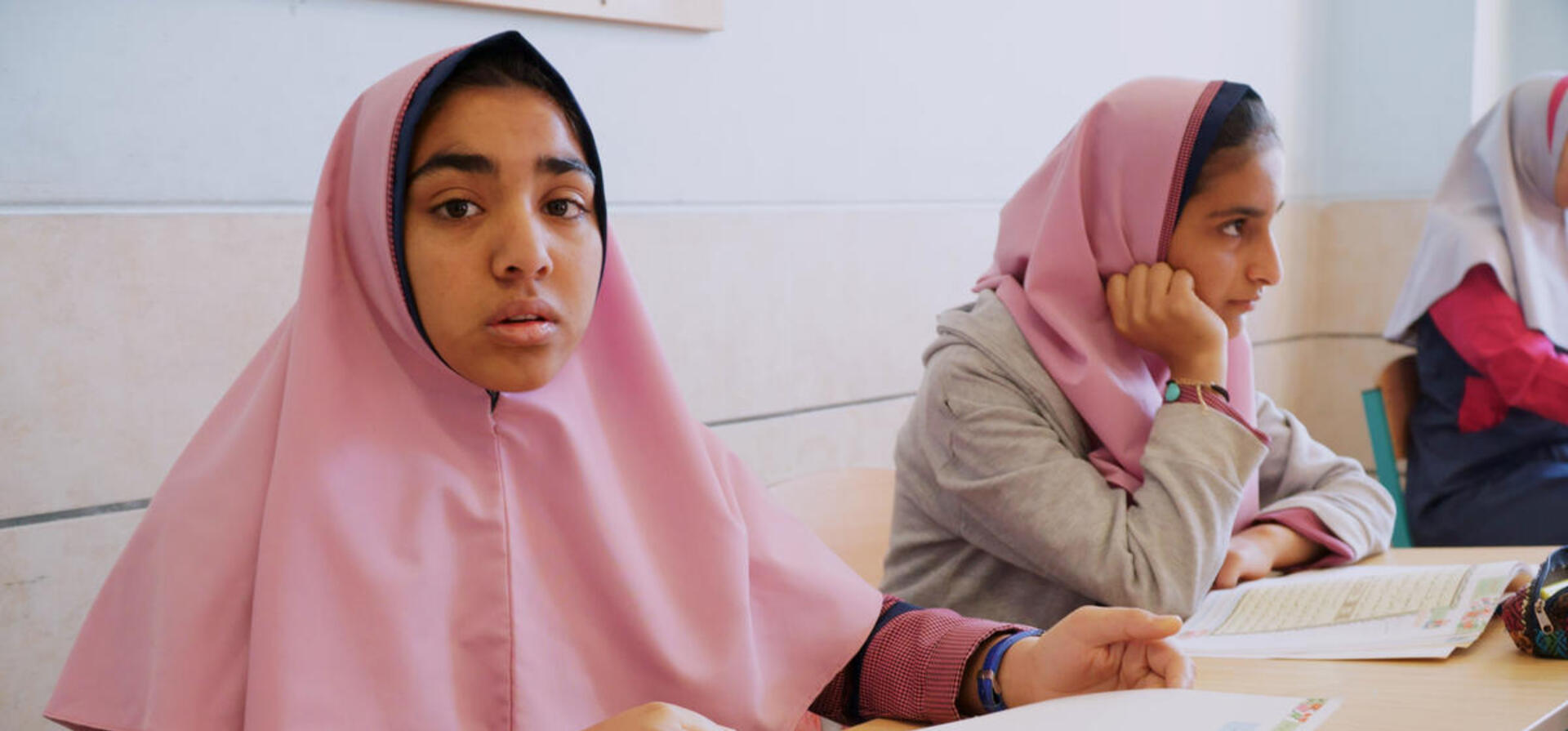 Iran. Afghan refugee sisters go to school for the first time