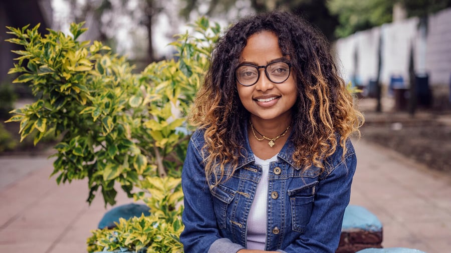 Mielena, a young woman, smiles at the camera