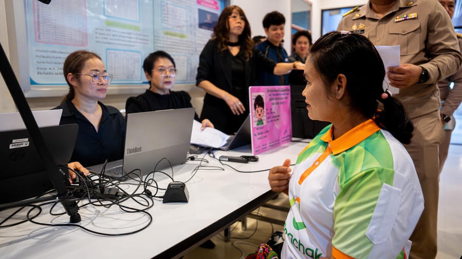 Thailand. A refugee from Myanmar undergoes the registration process for her identification card