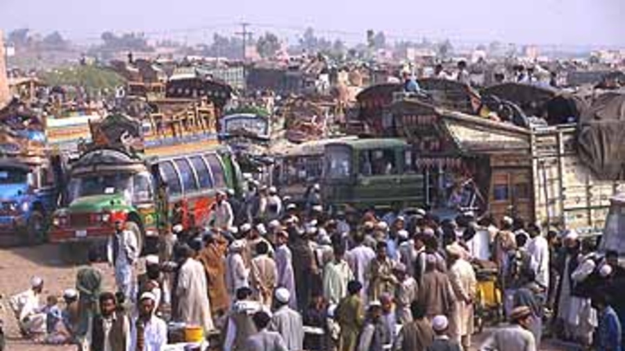 Afghans prepare to return home at the Takhta Baig registration centre near Peshawar.