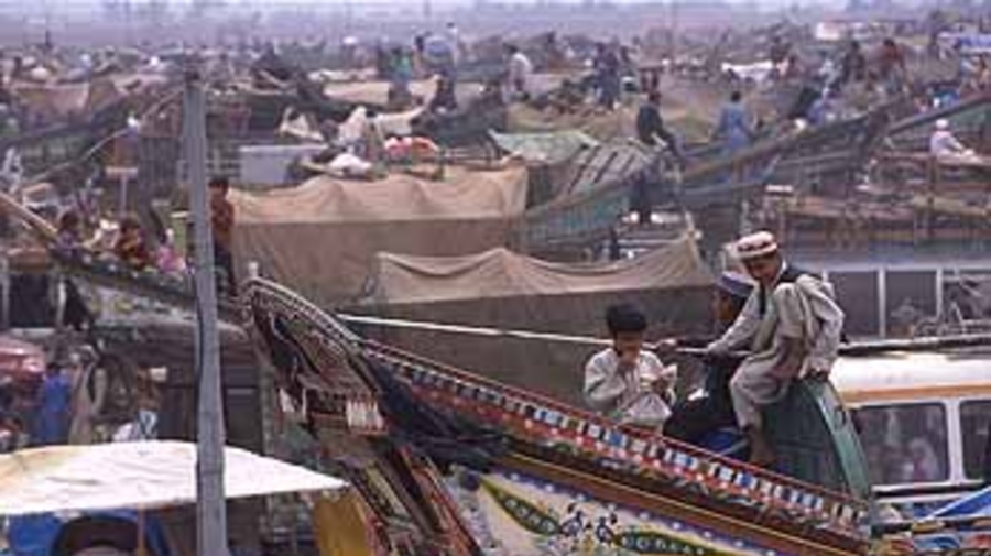 At UNHCR's Takhta Baig registration centre in Pakistan, thousands of Afghan refugees wait for improved security before completing the trip home.