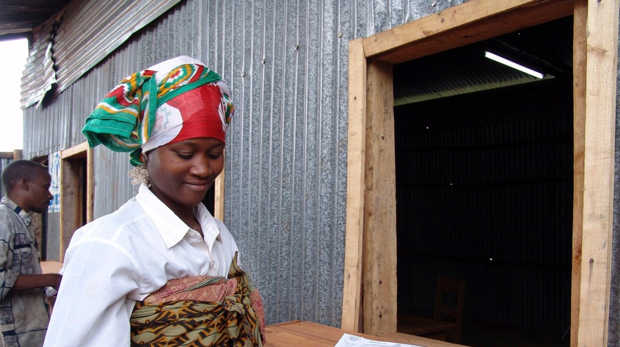 A smiling woman outside
