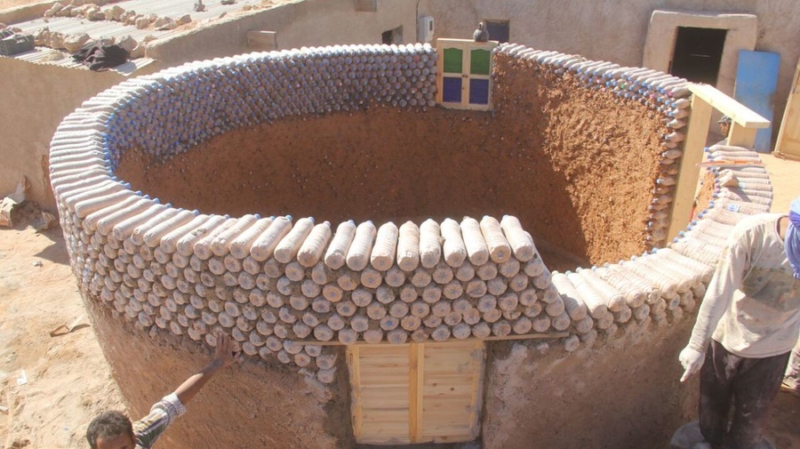 Algeria. Bottling sand to build better shelters for refugees