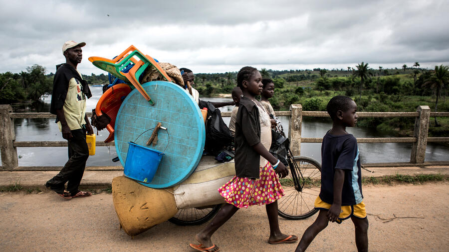 Democratic Republic of Congo. A family of Internally displaced persons are seen on the road whilst fleeing to kananga.