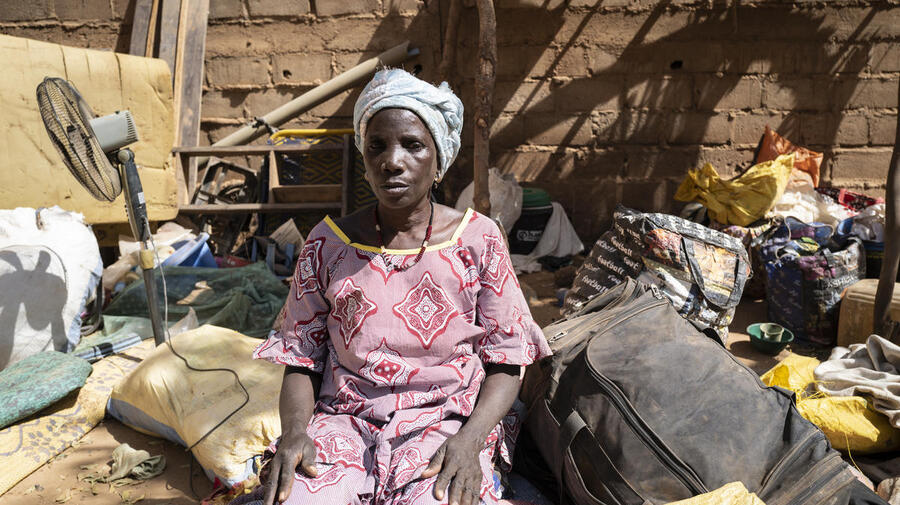 An internally displaced Burkinabe woman sits among belongings in Kaya, Burkina Faso, February 2020.