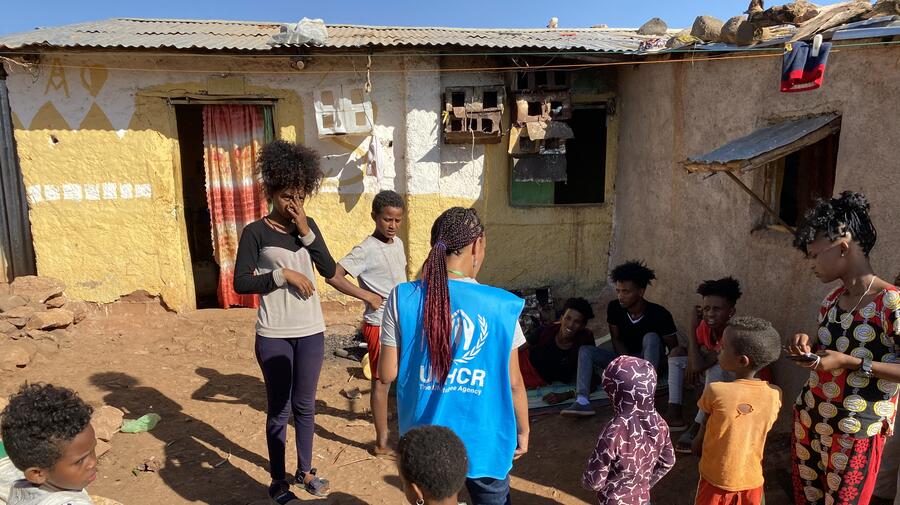 A UNHCR officer talks to refugees in Mai Aini refugee camp. The biggest concerns of the refugees are food, clean water, and the security situation in the camps. The refugees report almost nightly looting by armed gangs. 