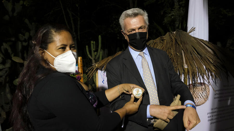 UN High Commissioner for Refugees Filippo Grandi meets Venezuelan entrepreneur Jazhilmar Baez at an event in Quito, Ecuador.