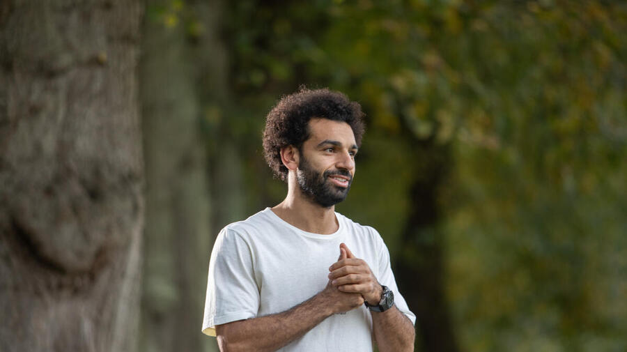 Egypt. Liverpool striker Mo Salah pays a virtual visit to refugees and local children studying in a classroom