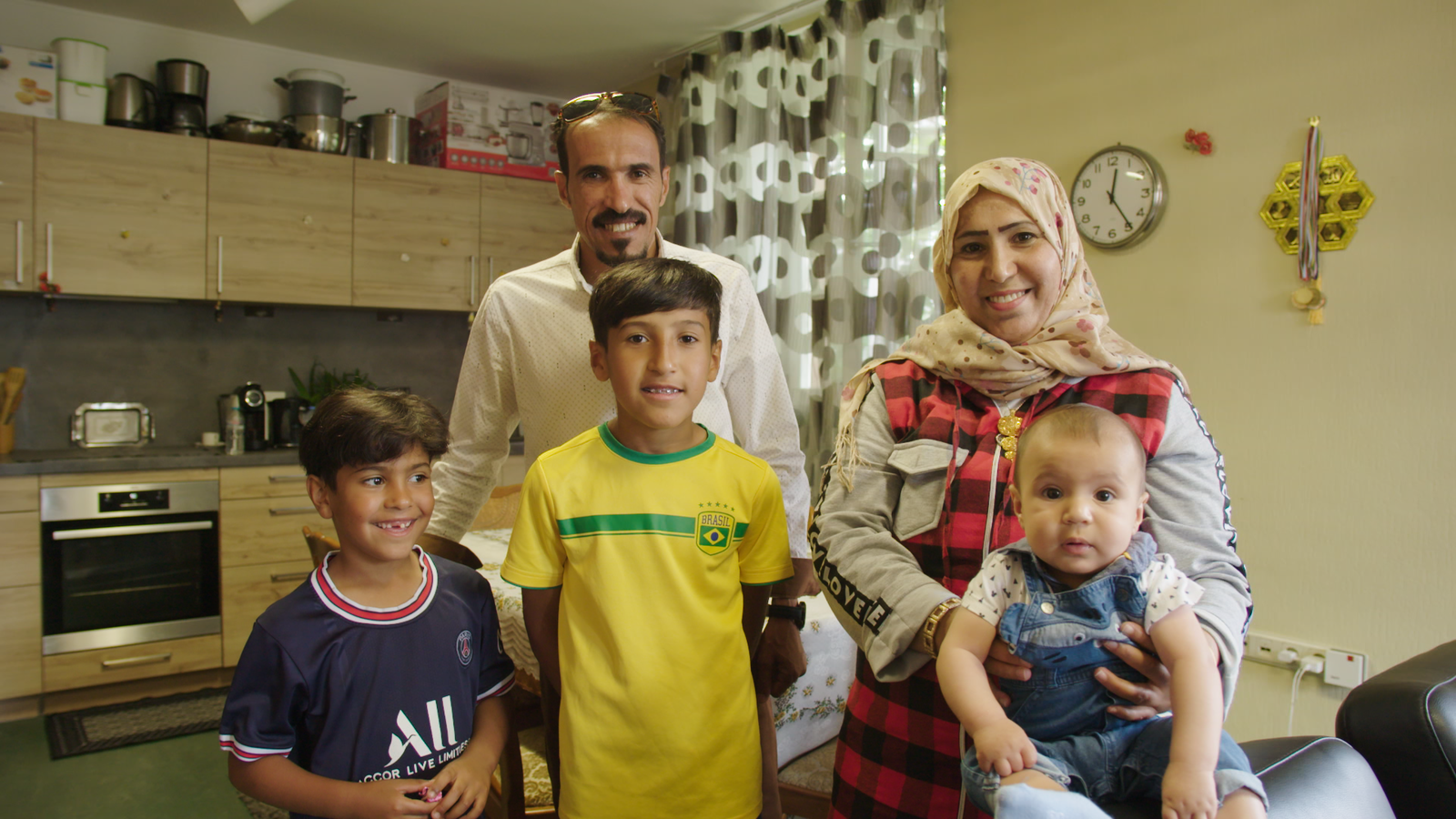 The Al Enezi family, Mohamed, Amina and their three boys, Hussein, the oldest Fahed in the middle and baby boy Kazem © UNHCR/Frederik Bordon