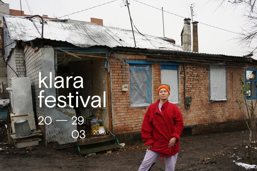 Nadiia, in front of what's left of her house in Ukraine