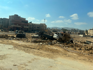 Wrecked cars lie in an area of wasteland after deadly floods in the Libyan city of Derna.