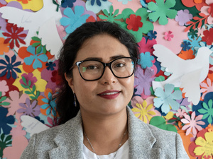 Sediqa Danish Nawrozi in front of a colourful background