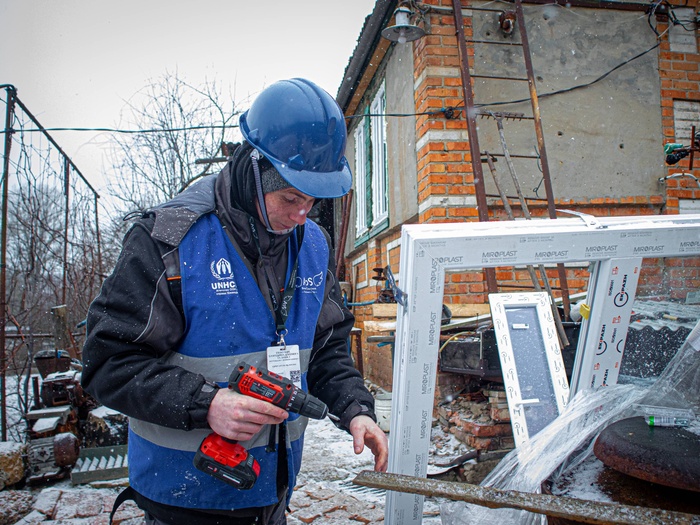 People fixing houses