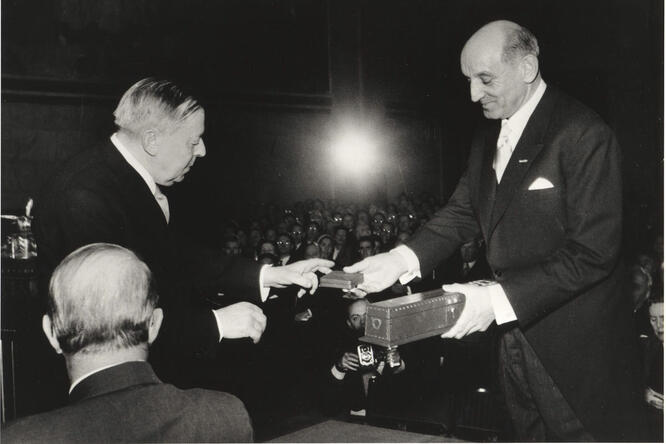 Mr. Gunnar Jahn, Chairman of the Norwegian Nobel Committee, hands the Nobel Peace prize to to the United Nations High Commissioner.