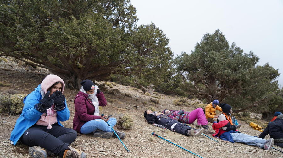 Morocco. Refugee women climbing the Toubkal.
